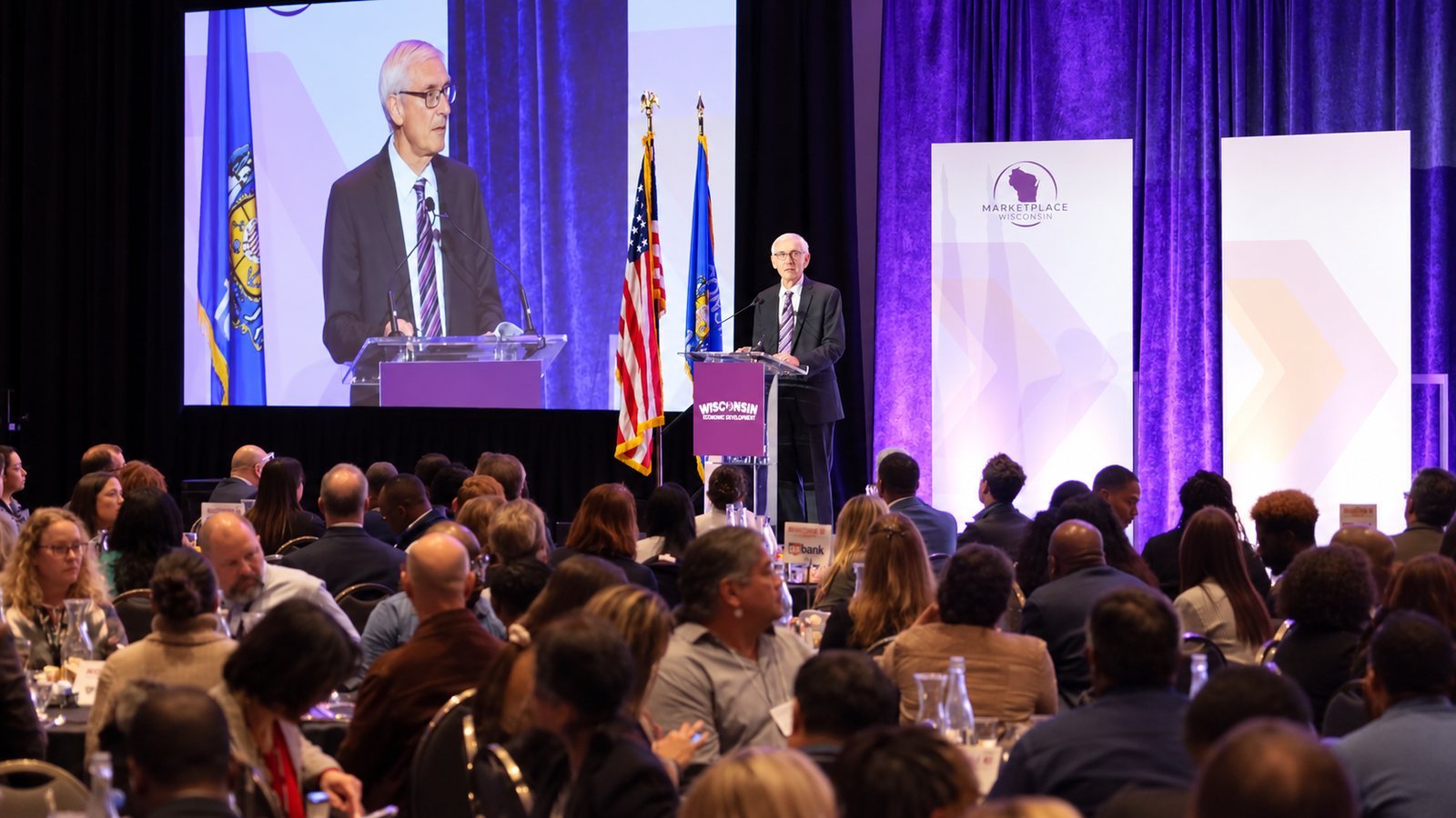 Keynote speaker on stage at a Wisconsin business conference