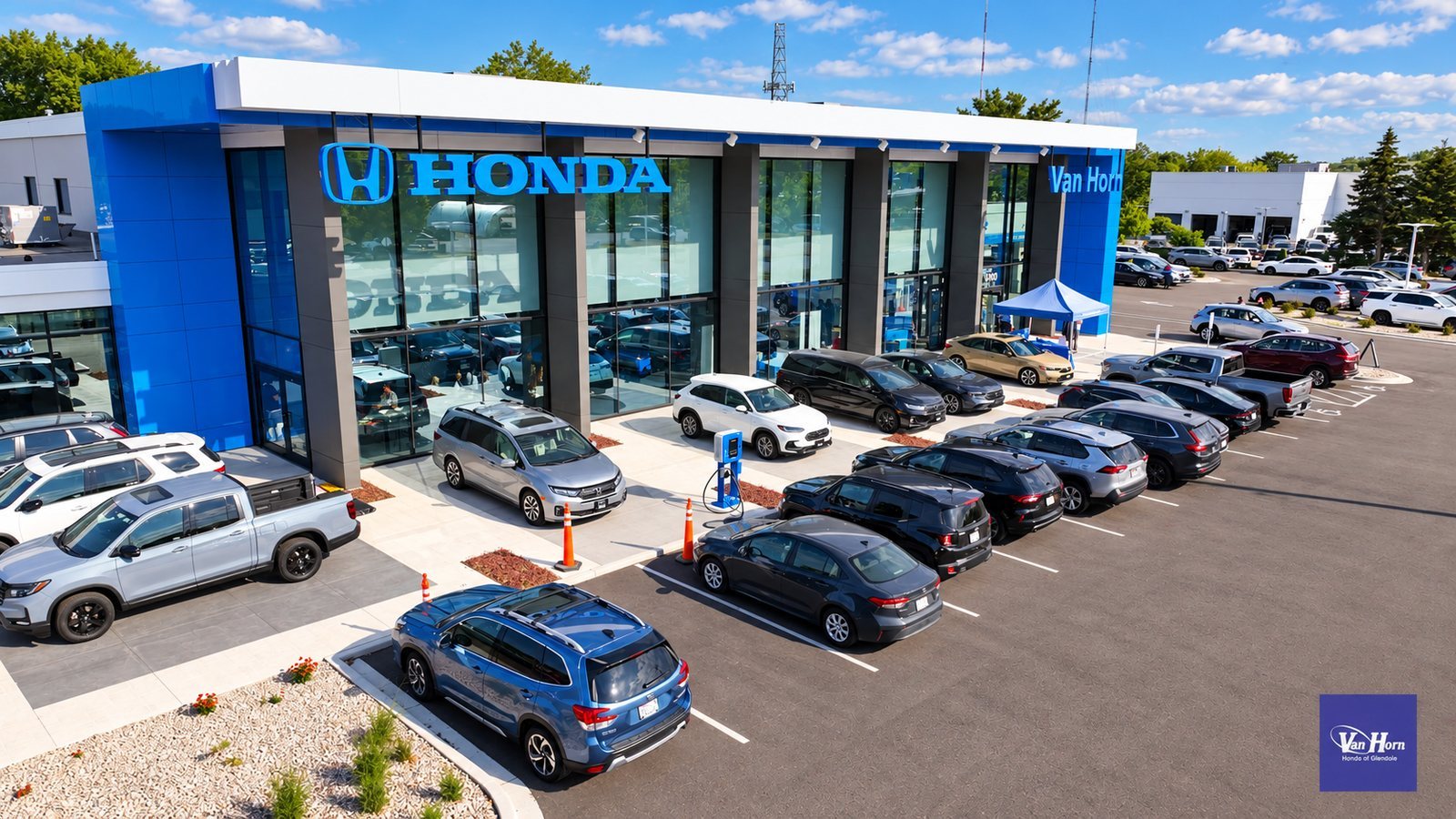 Aerial view of a car dealership under blue skies