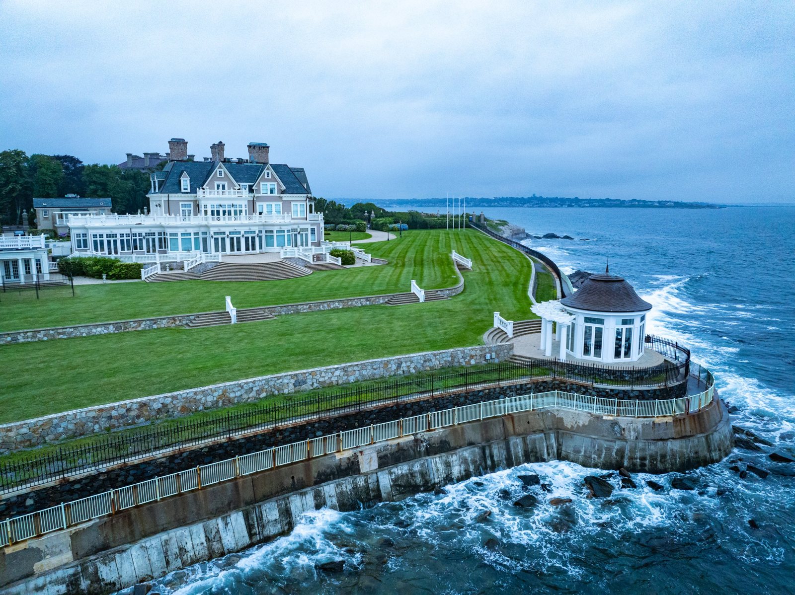 Aerial of a coastal estate with a gazebo over the water