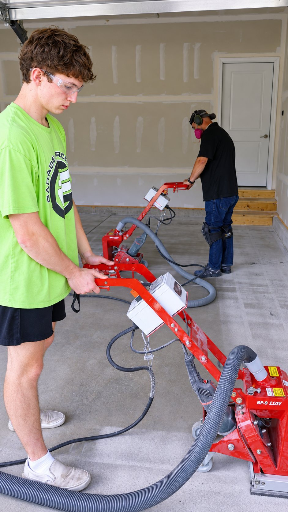 Two workers in a garage workshop during a social media video shoot