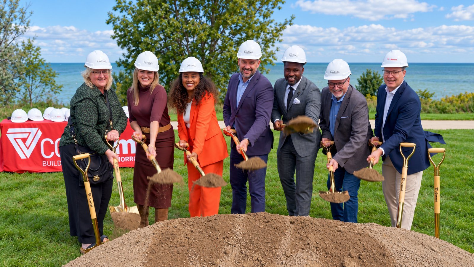 Groundbreaking ceremony with shovels on the Lake Michigan shore