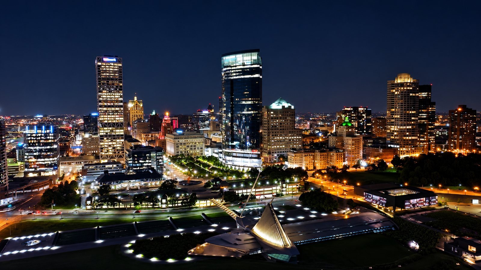 Aerial view of the Milwaukee skyline and art museum at night, filmed by Bokeh Film Production